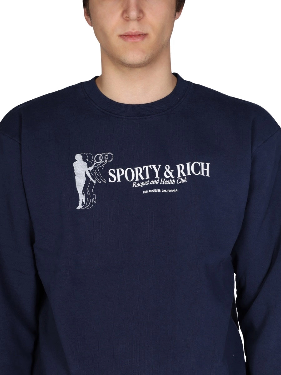 Sporty & Rich Racquet Crewneck Sweatshirt